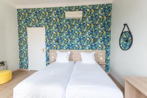 Postel nebo postele na pokoji v ubytování Hotel Aria
