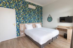 Postel nebo postele na pokoji v ubytování Hotel Aria