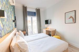 Postel nebo postele na pokoji v ubytování Hotel Aria