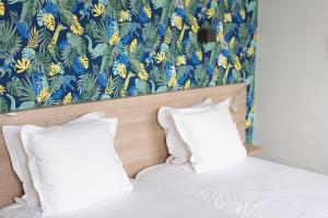 Postel nebo postele na pokoji v ubytování Hotel Aria