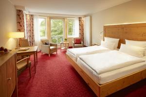Postel nebo postele na pokoji v ubytování Hotel Deimann