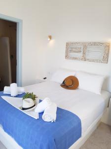 Ένα ή περισσότερα κρεβάτια σε δωμάτιο στο Glaros Hotel (By The Sea)