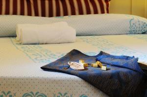 Postel nebo postele na pokoji v ubytování Hotel Baja Romantica