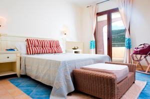 Postel nebo postele na pokoji v ubytování Hotel Baja Romantica