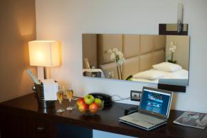Posteľ alebo postele v izbe v ubytovaní Hotel Villa Völgy Wellness & Konferencia
