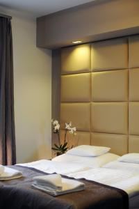 Posteľ alebo postele v izbe v ubytovaní Hotel Villa Völgy Wellness & Konferencia