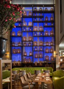 a restaurant with a large wall of wine bottles at Grand Hyatt Chengdu in Chengdu