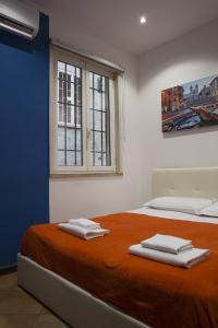 Postel nebo postele na pokoji v ubytování Trasteverome45 + 29 fotografií
