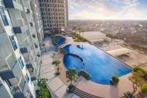 an overhead view of a swimming pool in a building at Luxury 2 Bed Room Anderson Apartment Pakuwon Mall in Surabaya