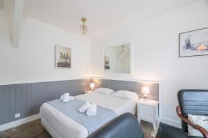 Cama o camas de una habitación en Appart'Hôtel Bellevue