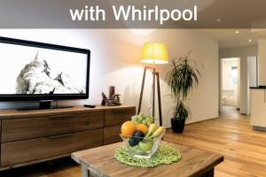 TV a/nebo společenská místnost v ubytování Apartment Olympia Mischabel