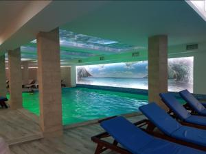a room with a swimming pool with a view of the ocean at Milmari RELAX apartment in Kopaonik