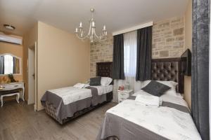 Postel nebo postele na pokoji v ubytování Villa Imperia ZadarVillas