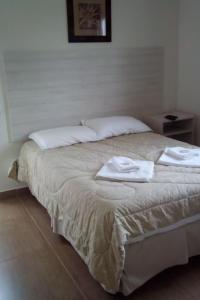 Ένα ή περισσότερα κρεβάτια σε δωμάτιο στο Hotel Vison