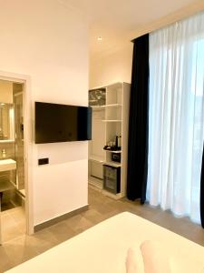 TV a/nebo společenská místnost v ubytování THE ONE - SUN 'n SEA ROOMS