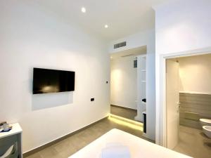 TV a/nebo společenská místnost v ubytování THE ONE - SUN 'n SEA ROOMS