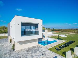 an aerial view of a house with a swimming pool at Villa F&A ZadarVillas in Donje Raštane