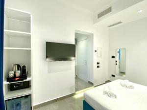 TV a/nebo společenská místnost v ubytování THE ONE - SUN 'n SEA ROOMS