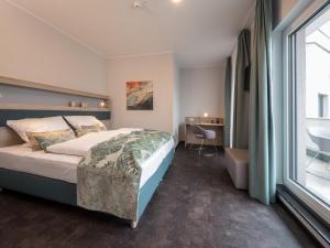 Ein Bett oder Betten in einem Zimmer der Unterkunft RS-HOTEL - smart & modern Hotel Apartments
