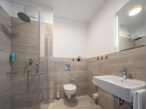Ein Badezimmer in der Unterkunft RS-HOTEL - smart & modern Hotel Apartments