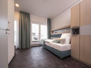 Ein Bett oder Betten in einem Zimmer der Unterkunft RS-HOTEL - smart & modern Hotel Apartments