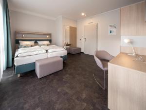 Ein Bett oder Betten in einem Zimmer der Unterkunft RS-HOTEL - smart & modern Hotel Apartments