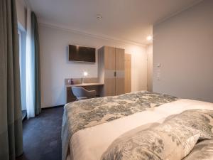 Ein Bett oder Betten in einem Zimmer der Unterkunft RS-HOTEL - smart & modern Hotel Apartments