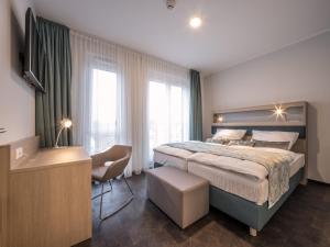 Ein Bett oder Betten in einem Zimmer der Unterkunft RS-HOTEL - smart & modern Hotel Apartments
