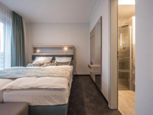Ein Bett oder Betten in einem Zimmer der Unterkunft RS-HOTEL - smart & modern Hotel Apartments