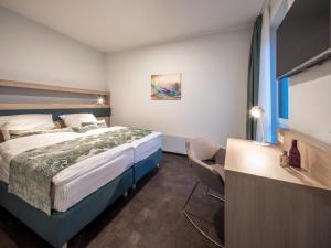 Ein Bett oder Betten in einem Zimmer der Unterkunft RS-HOTEL - smart & modern Hotel Apartments