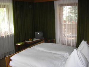Postel nebo postele na pokoji v ubytování Burgblick + 14 fotografií