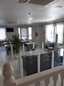 a kitchen area with a table and chairs at Hotel Cano in Torrevieja
