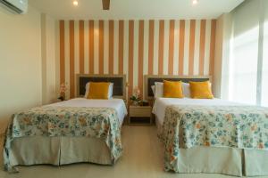 Hotel Santorini Loft客房内的一张或多张床位
