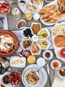 a table with many plates of food on it at Riad Atlas Imlil in Imlil