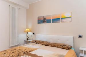 A bed or beds in a room at Appartamento Vicino al Mare