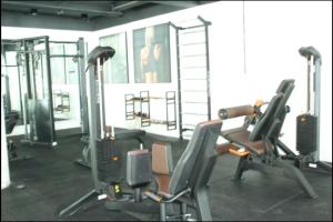 a gym with two tread machines in a room at Maravilhoso Apartamento Reserva DNA Ubatuba in Ubatuba