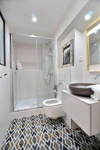 a bathroom with a shower and a toilet and a sink at 102216 - Appartement 4 personnes Montorgueil in Paris