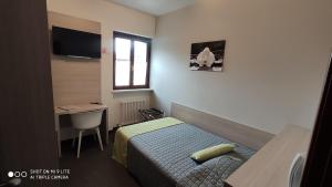 Postel nebo postele na pokoji v ubytování Hotel Del Negro