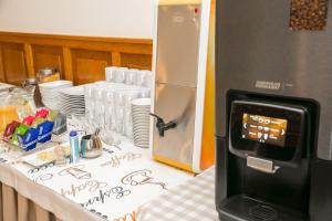 A kitchen or kitchenette at Hotel Oaza