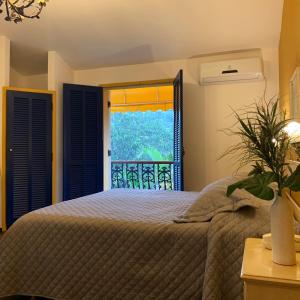 Ένα ή περισσότερα κρεβάτια σε δωμάτιο στο Pousada Villa Real +78 φωτογραφίες