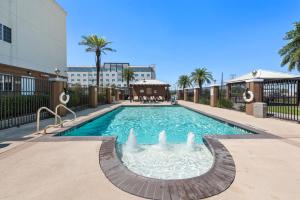 a swimming pool with a fountain in the middle of a building at Extended Stay America Suites - San Antonio - North in San Antonio