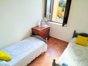 A bed or beds in a room at Summer Dream LA CASA SUL MARE