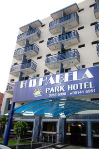 a hotel with a sign for a park hotel at Ilhabela Park Hotel in Brasília