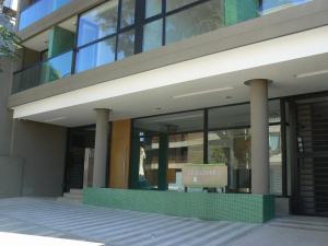 a building with a sign in front of it at Departamento de 2 ambientes luminoso in Mar del Plata