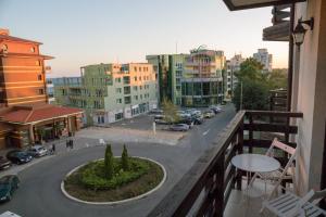 a view of a city street from a balcony at South Beach Apartment in Nesebar