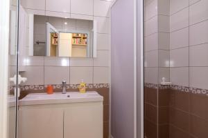 a bathroom with a sink and a mirror at South Beach Apartment in Nesebar +105 photos