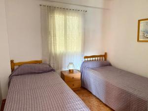 Posteľ alebo postele v izbe v ubytovaní SUN AND BEACH LOVERS 17159 La Pineda