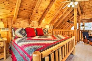 a bedroom with a large bed in a cabin at Gatlinburg Mountainside Escape with Deck and Hot Tub! in Gatlinburg
