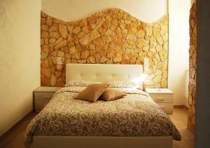 מיטה או מיטות בחדר ב-B&b Vittorio Emanuele II