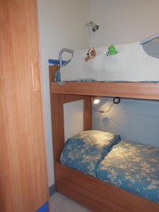 a bedroom with a bunk bed with a sink at Luxury apartment in Port Grimaud in Grimaud